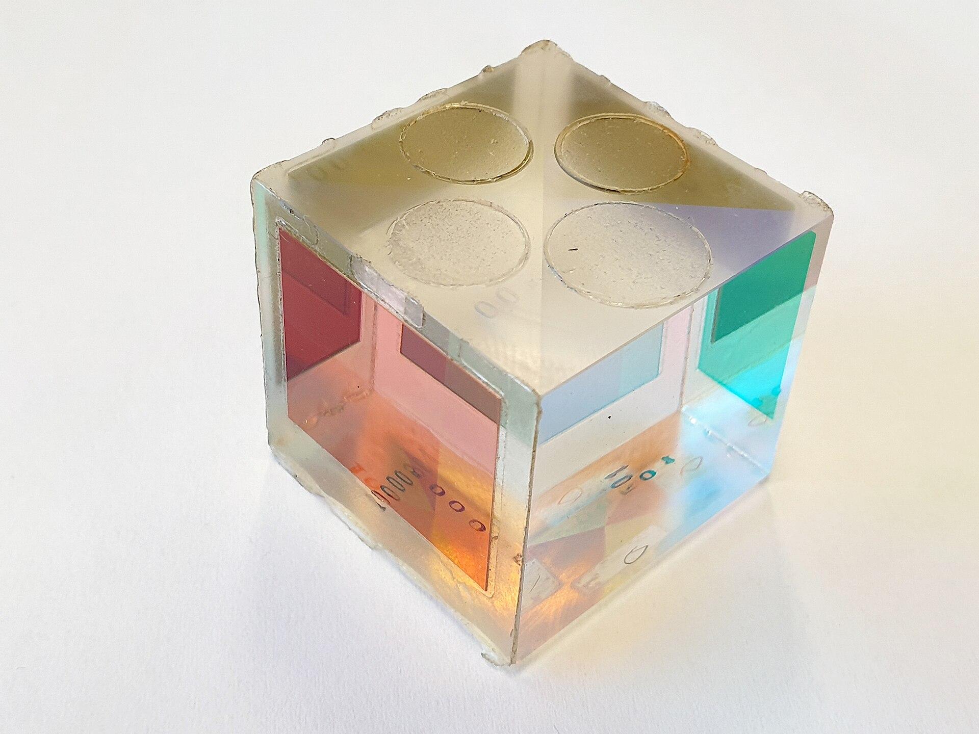 Glass prism cube with red, cyan and green faces